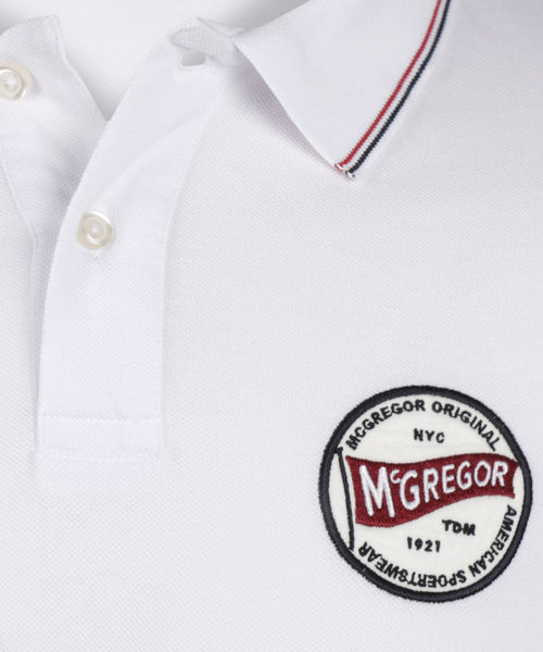 Polo with badge | White